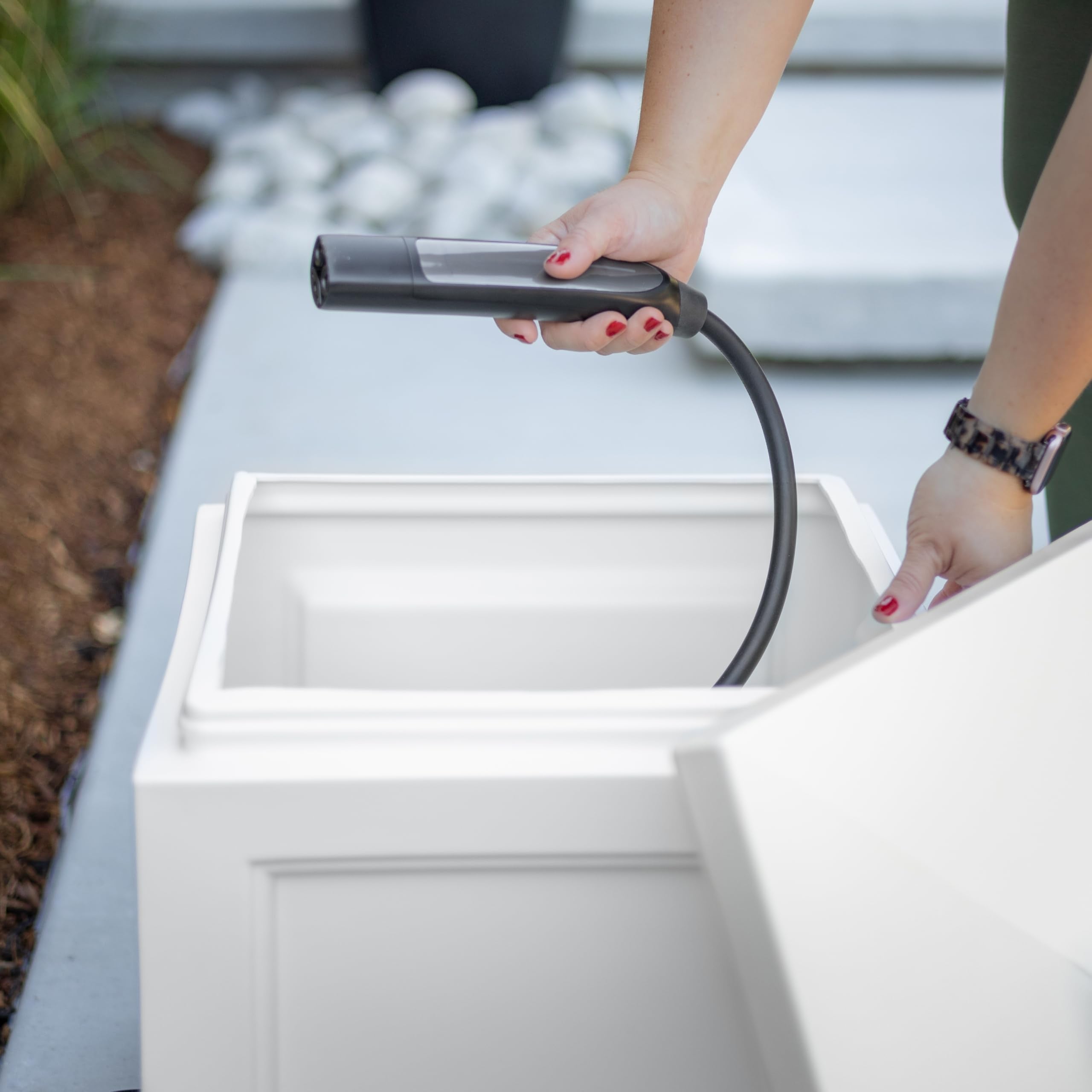 Mayne Fairfield storing EV charger showing tidy cable organization benefit