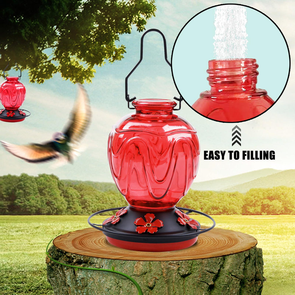 MCHBF feeder in hand for size comparison illustrating 24-ounce capacity