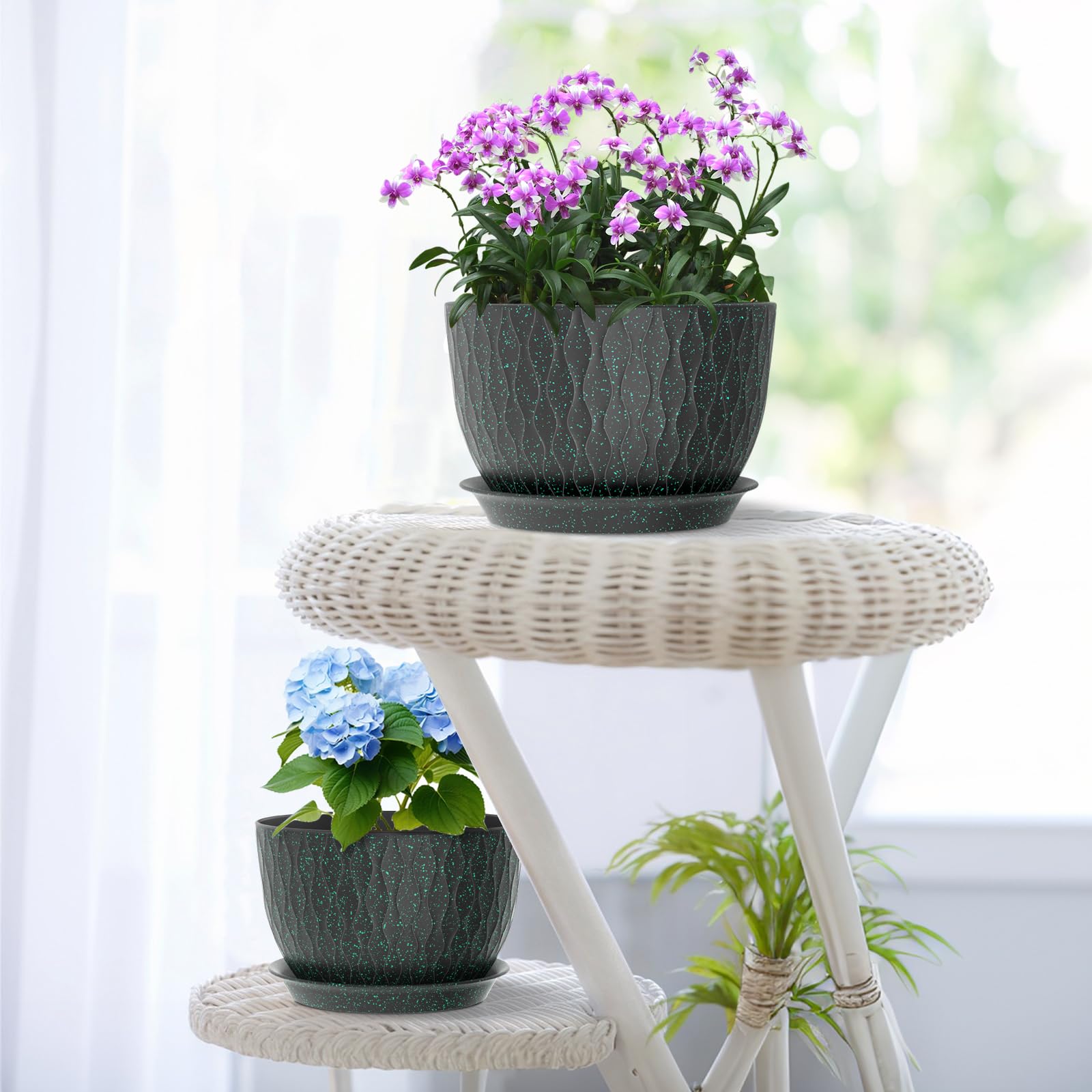 Meowell pots on patio with plants showing weather-resistant outdoor use