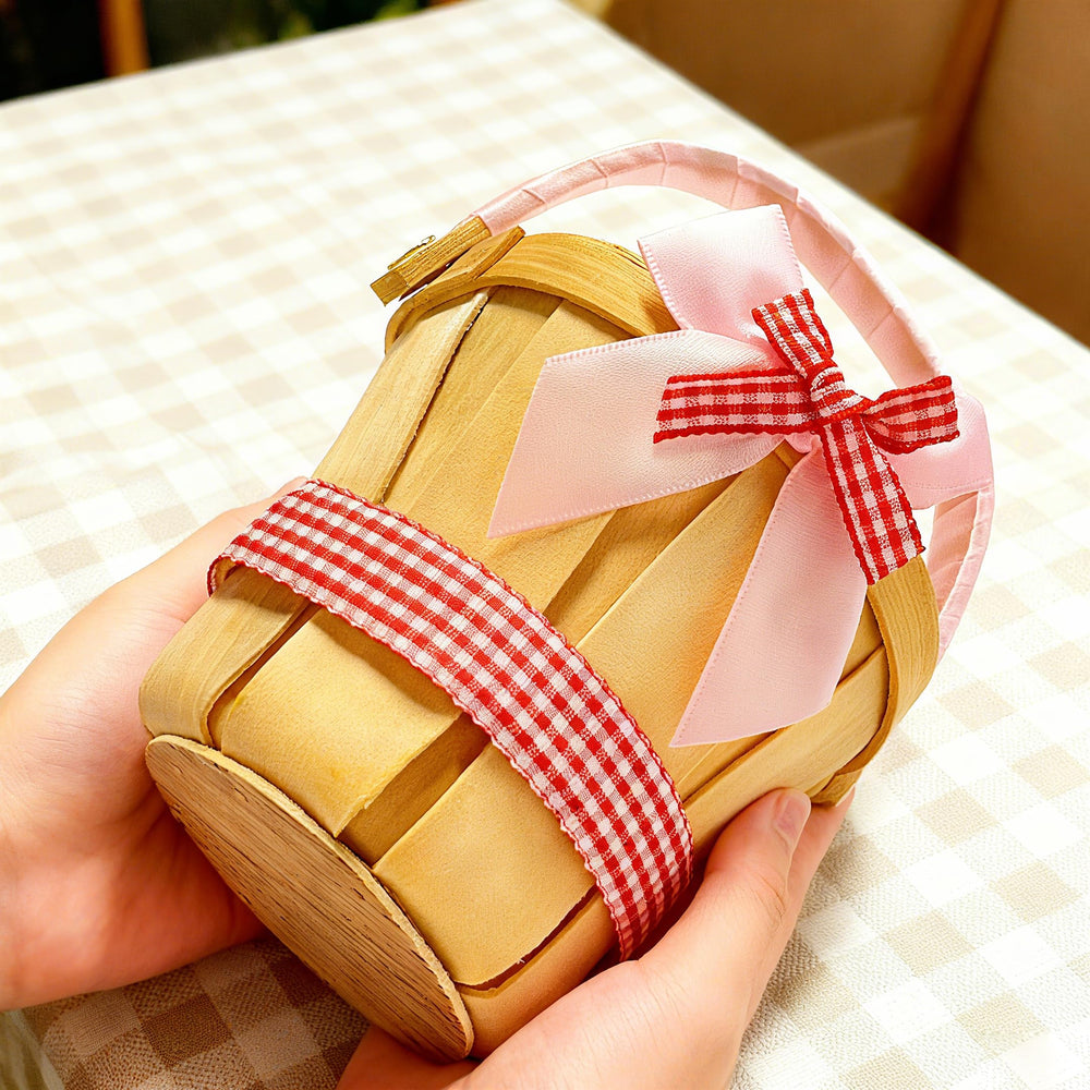 MEYAGO hand holding basket showing true small-scale size and portability