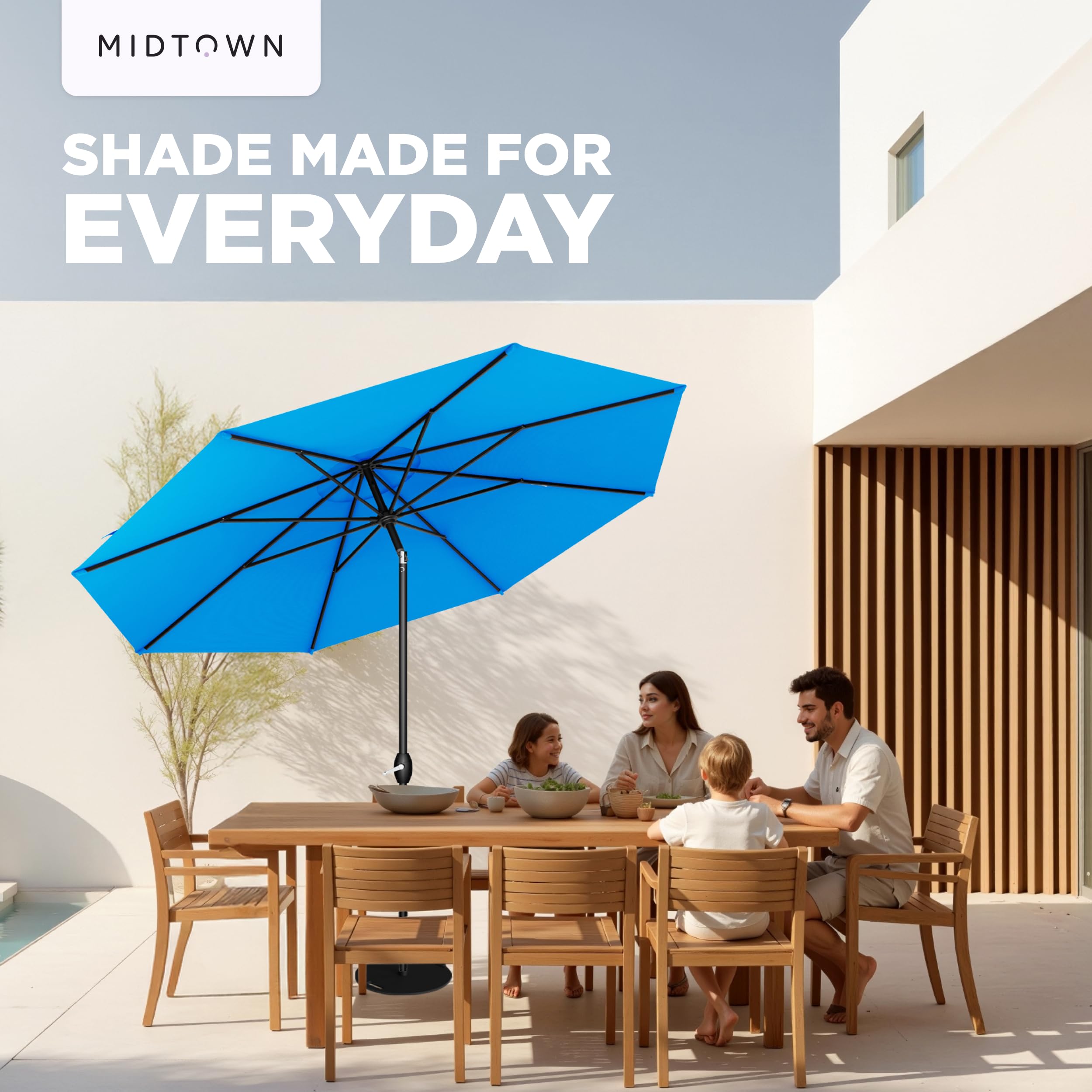 Midtown Umbrellas next to table showing 9 ft coverage and scale