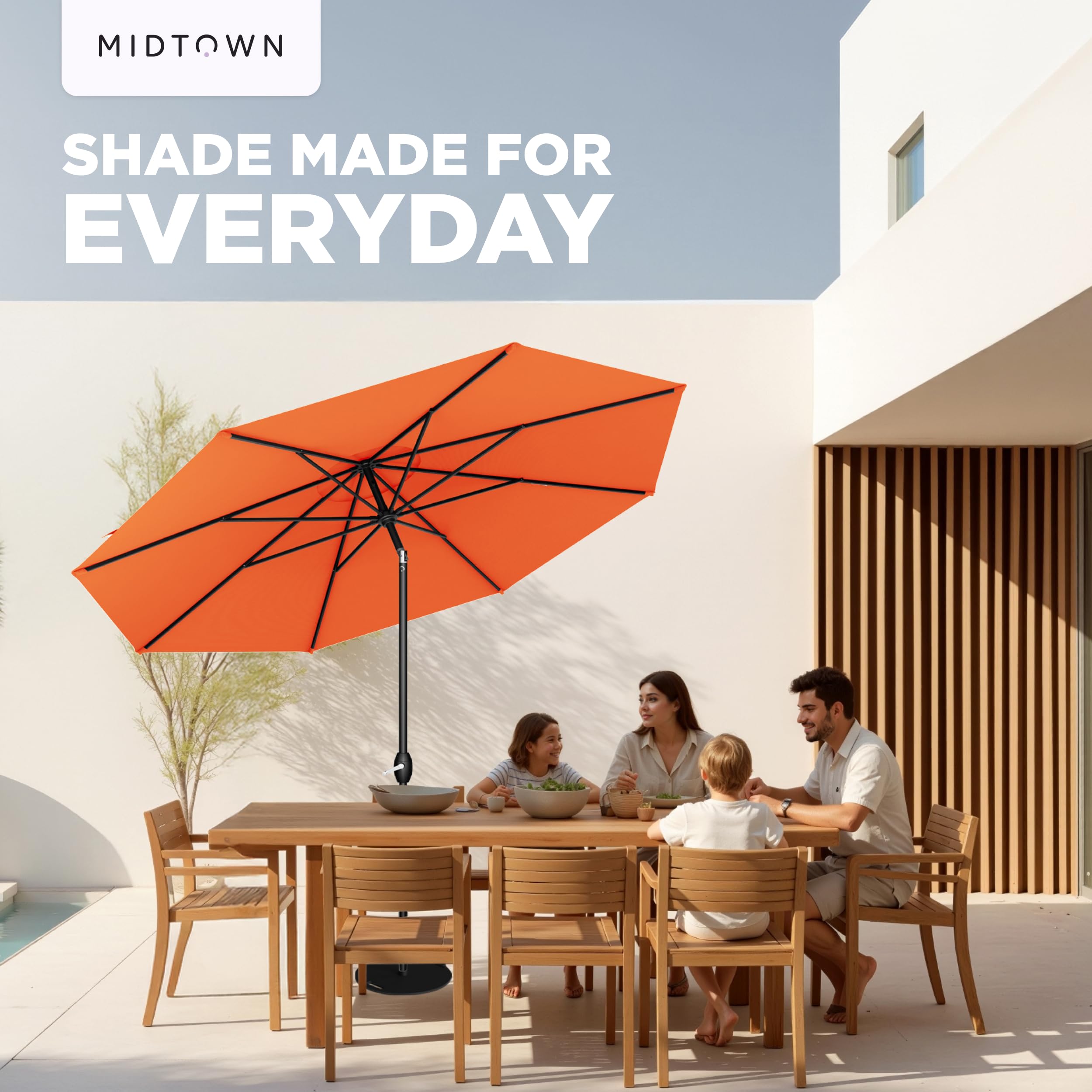 Midtown Umbrellas next to patio table showing 9 ft scale and coverage for 6–8 seats