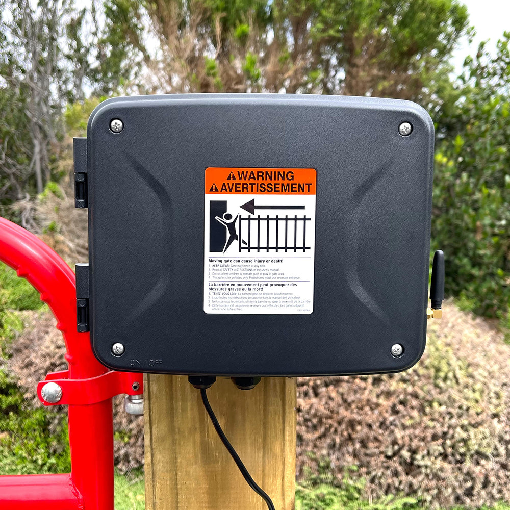 Mighty Mule enclosure mounted behind gate control box showing compact, unobtrusive installation benefit