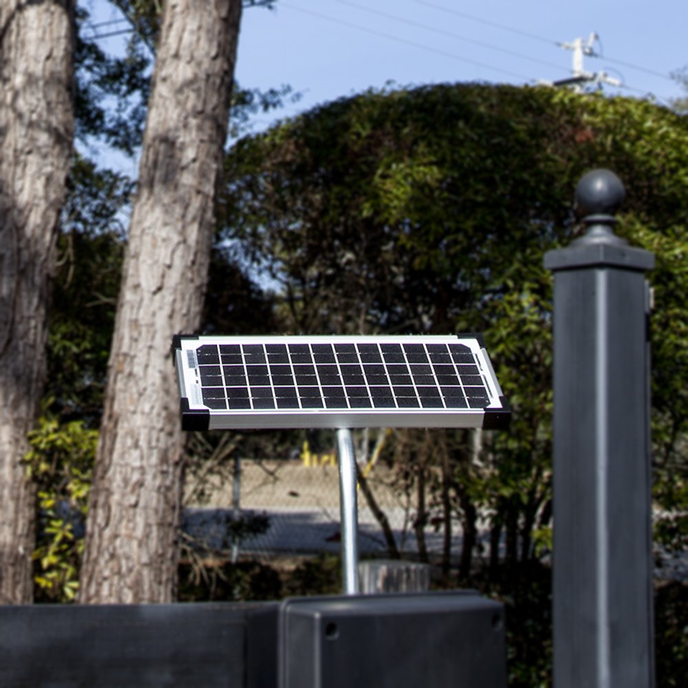 Mighty Mule 10W panel installed on a fence post powering gate opener and saving electricity
