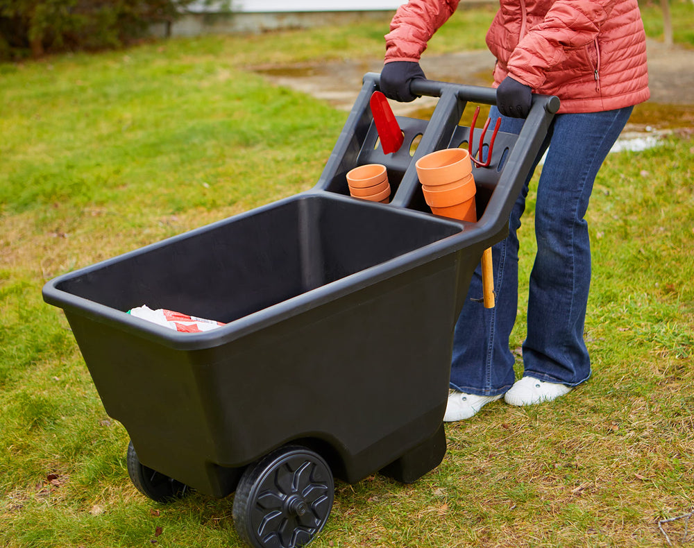 Mighty Tuff cart in backyard use transporting mulch to show practical convenience