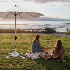 MILIMOLI assembled on sandy beach providing stable sunshade anchoring benefit