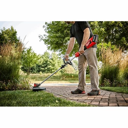 Milwaukee trimmer with M18 battery attached showing modular power flexibility