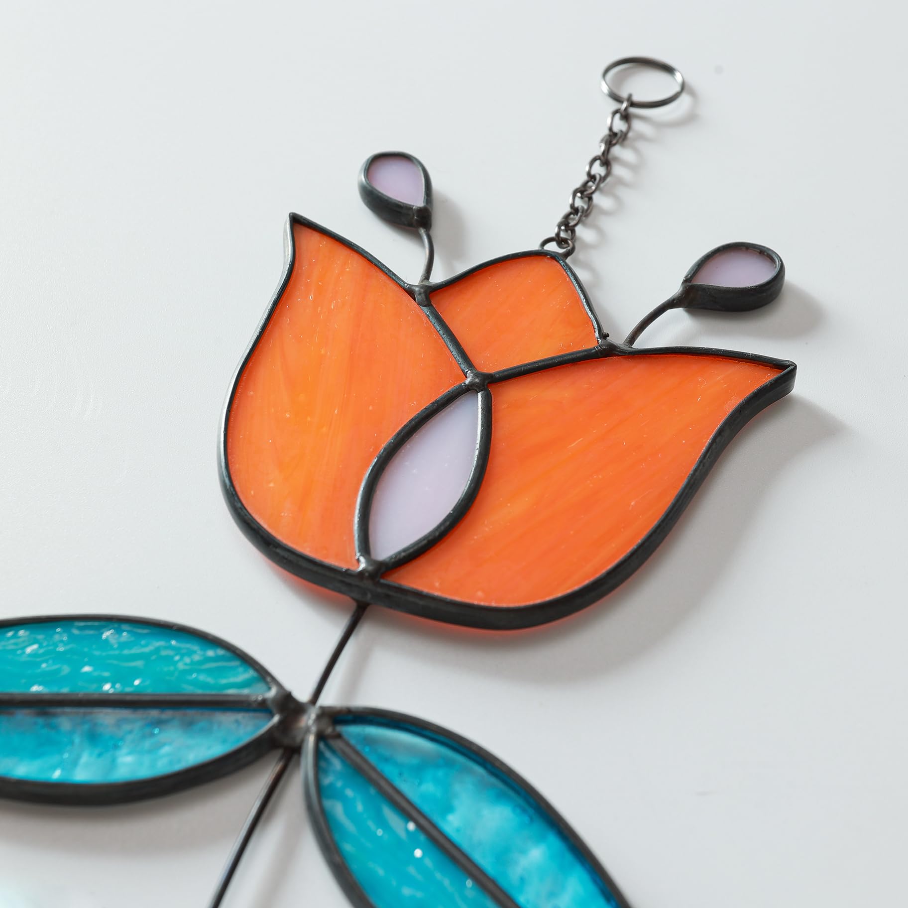 MintyWiz tulip hung in sunny window casting colorful light and cheerful ambiance