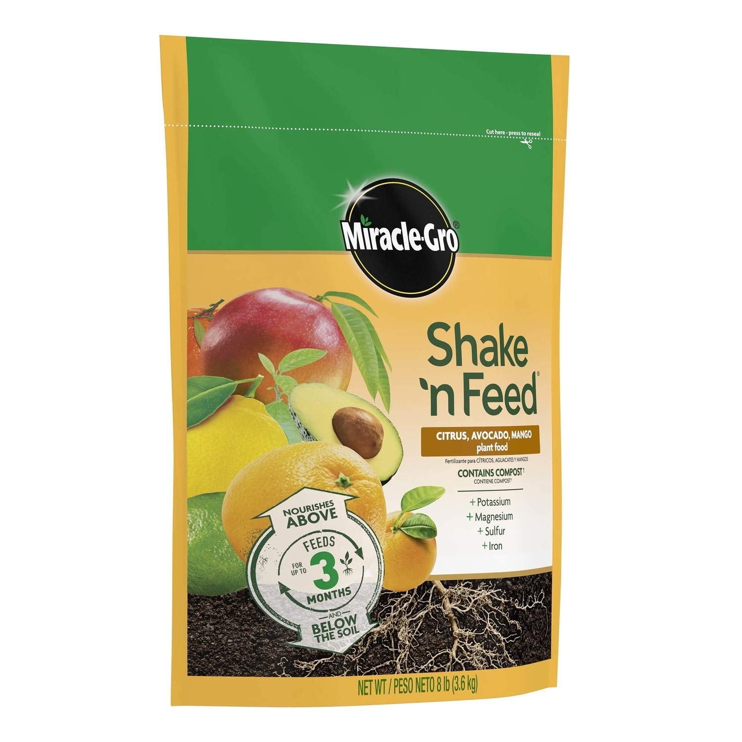 Miracle-Gro being shaken onto soil near tree canopy to start feeding quickly