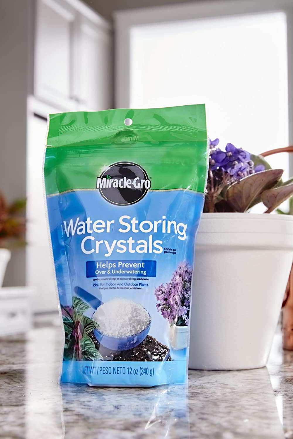 Miracle-Gro crystals mixed into potting mix showing improved moisture
