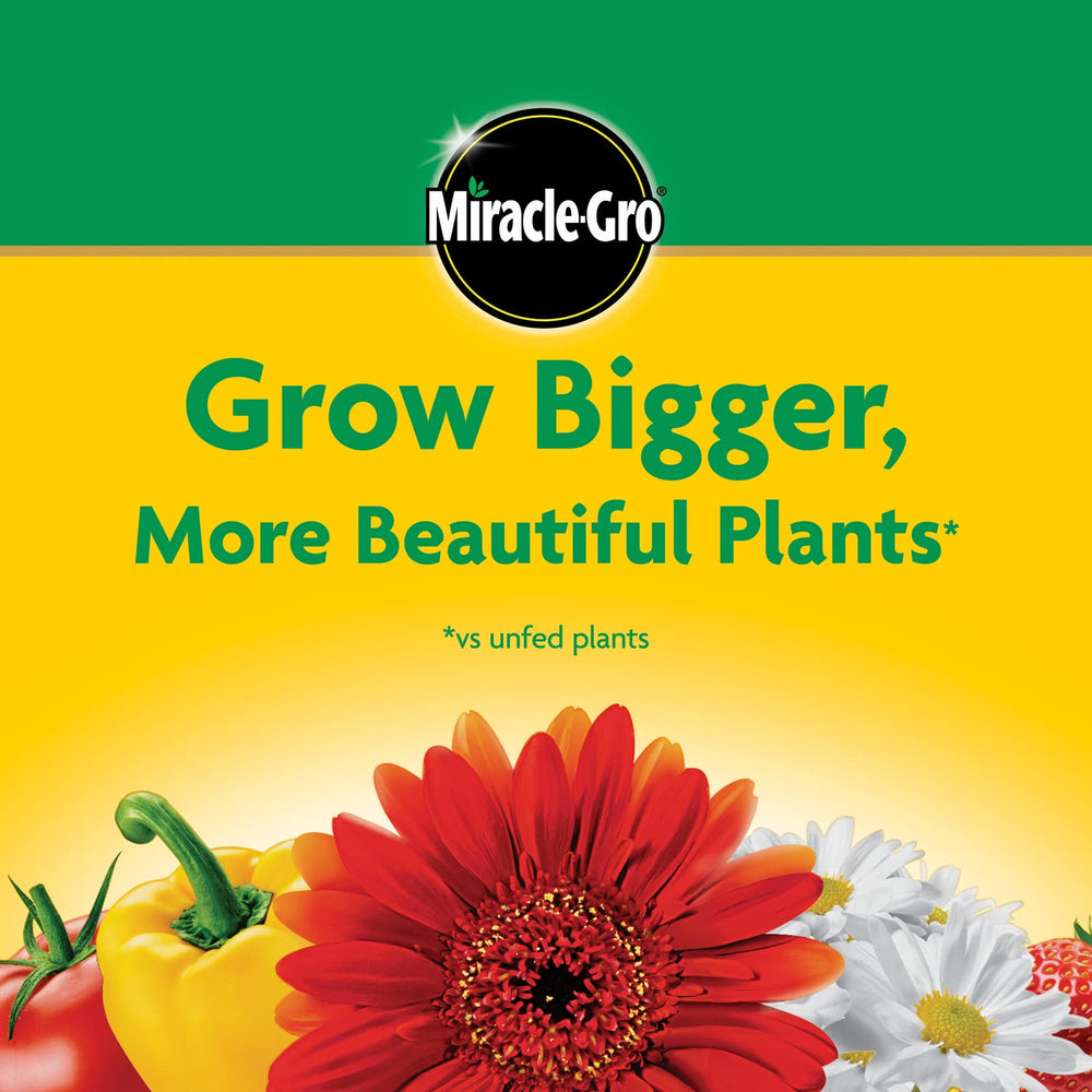 Miracle-Gro tub in a hand showing 10 lb scale for coverage