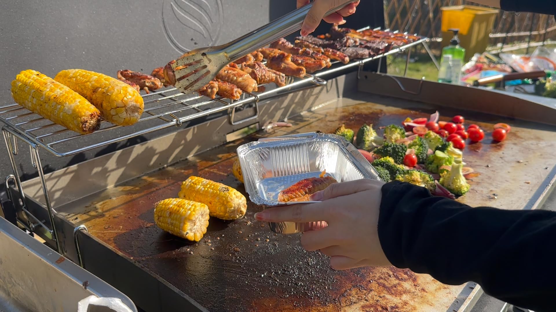 MixRBBQ installed on griddle showing raised indirect-heat cooking zone