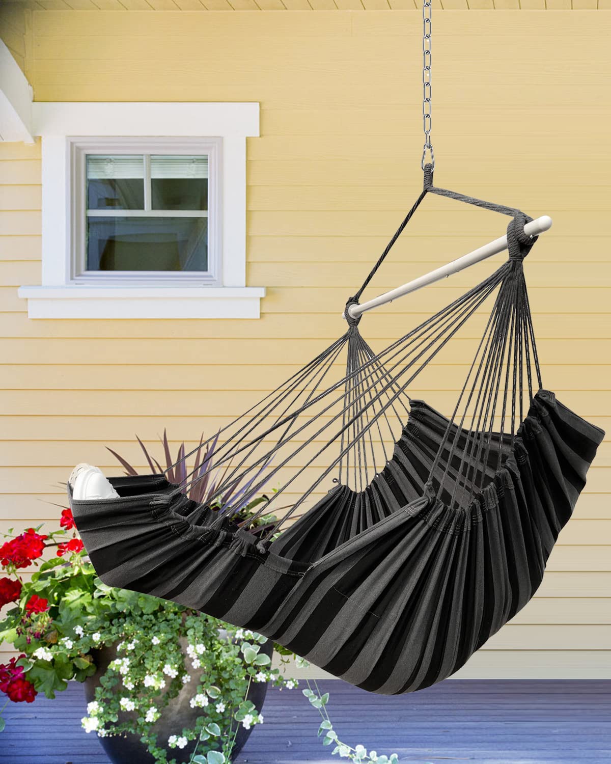 MIZTLI hammock chair in use indoors with foot rest providing ergonomic relaxation