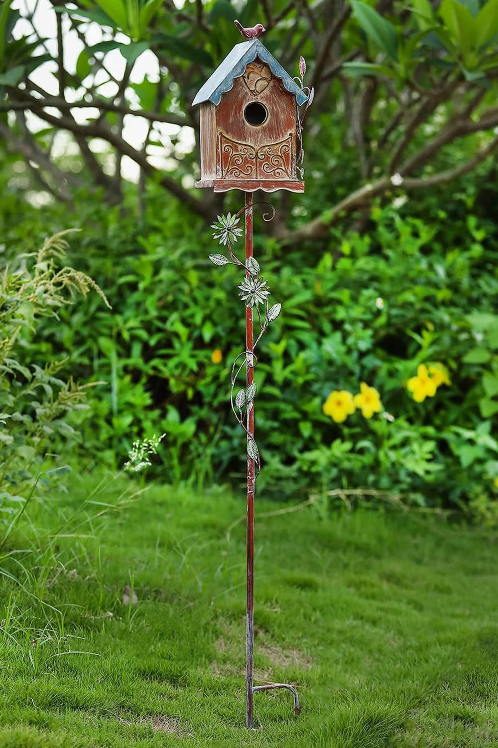 MOCOME birdhouse on patio among plants, creates charming outdoor focal point