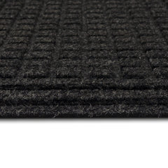 Mohawk Home doormat in doorway with shoes demonstrating water absorption and scraping