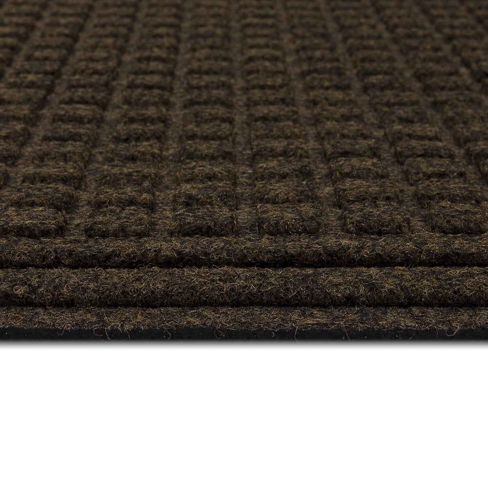 Mohawk Home doormat on porch in use with shoes removing debris before entering