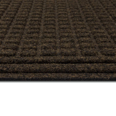 Mohawk Home doormat on porch in use with shoes removing debris before entering