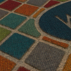Mohawk Home mat in use on porch trapping dirt and channeling water away