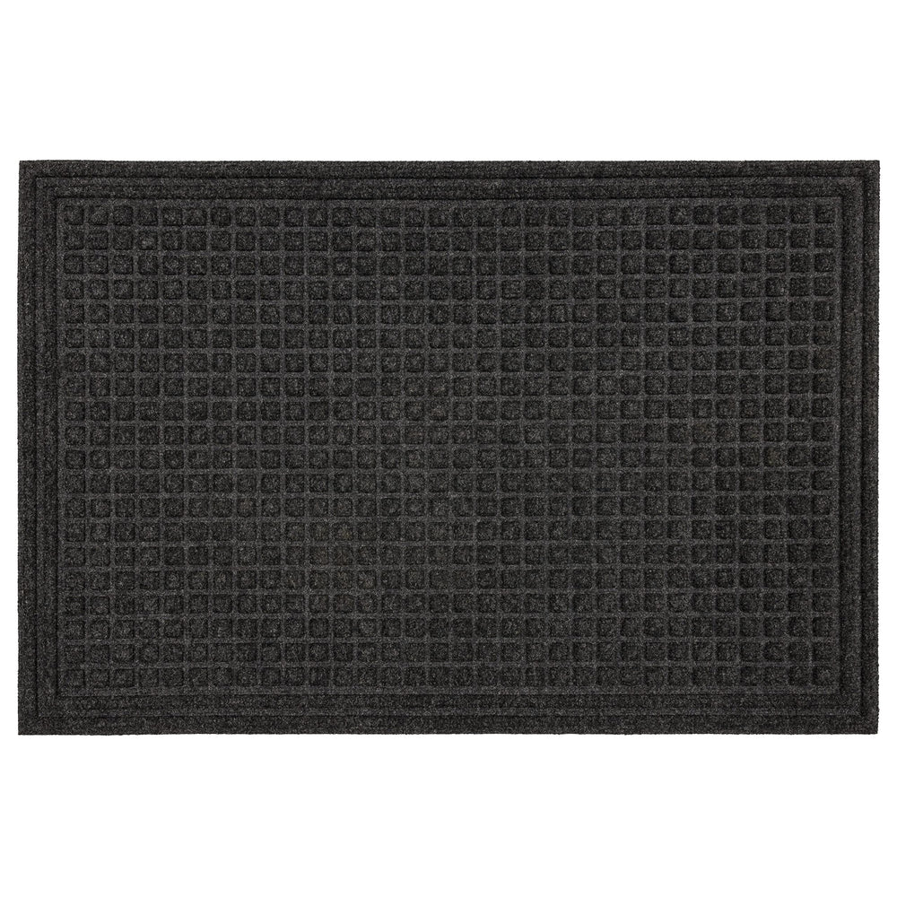 Mohawk Home recycled rubber backing detail showing non-slip grip and floor protection