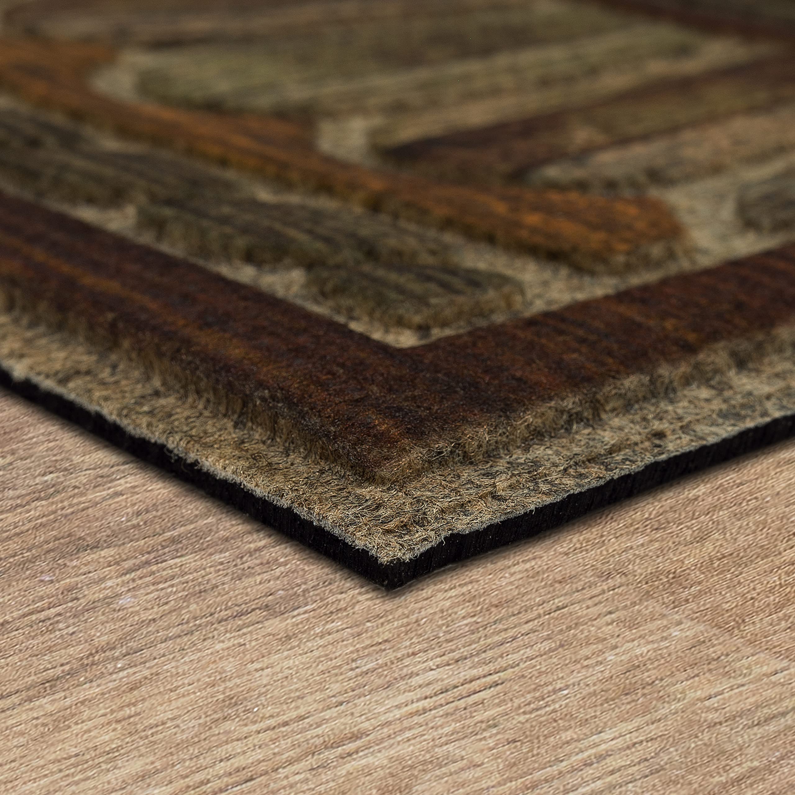 Mohawk Home mat in doorway illustrating low-profile fit under doors benefit