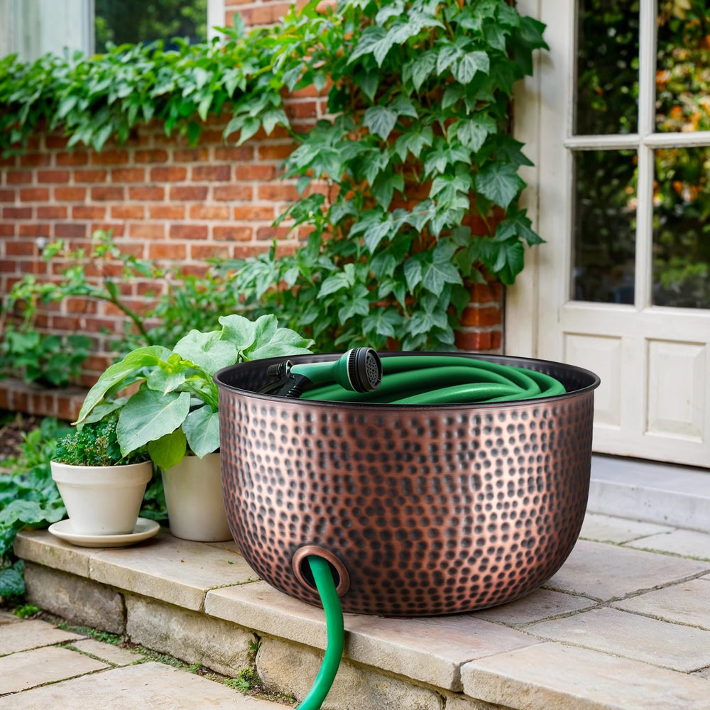 Monarch Abode placed on patio beside spigot, stylish outdoor hose storage