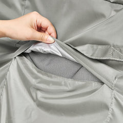 Monsoon detail of click-close leg strap securing the cover against wind