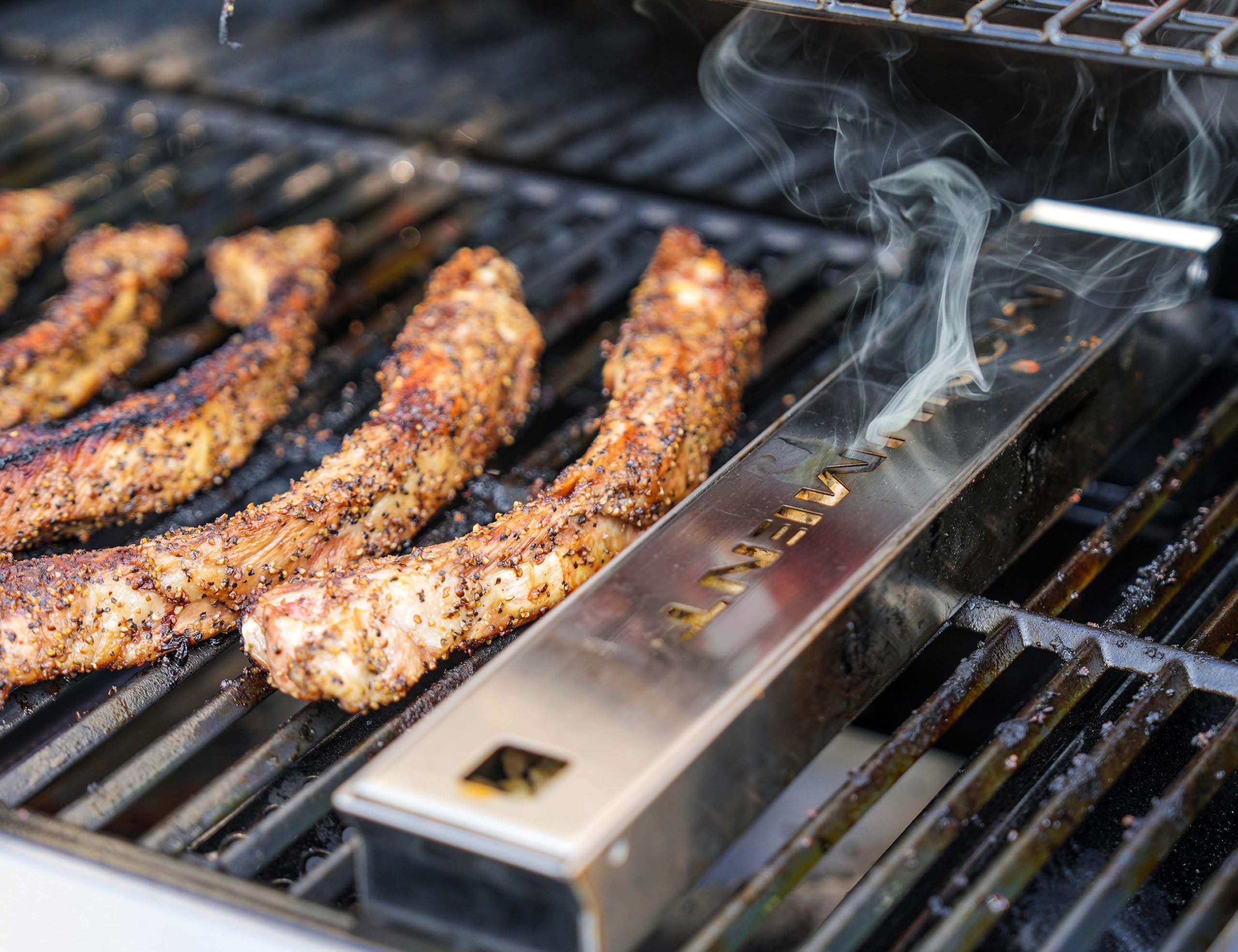Monument Grills smoker box front view showing durable stainless design and easy placement