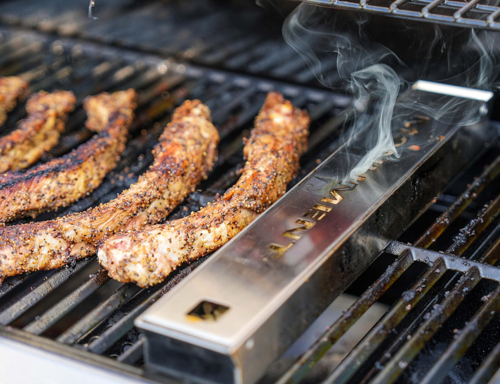 Monument Grills smoker box front view showing durable stainless design and easy placement