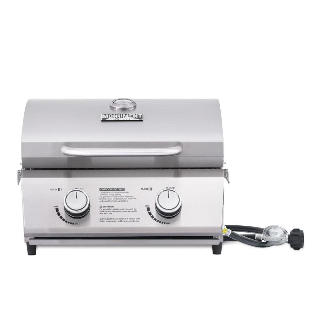Monument Grills front view with closed lid showing compact portability and secure travel locks