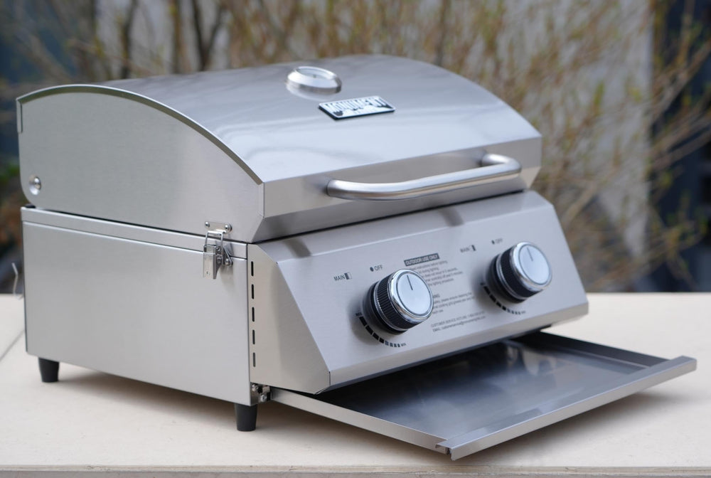 Monument Grills stainless burners and control knobs emphasizing reliable heat control