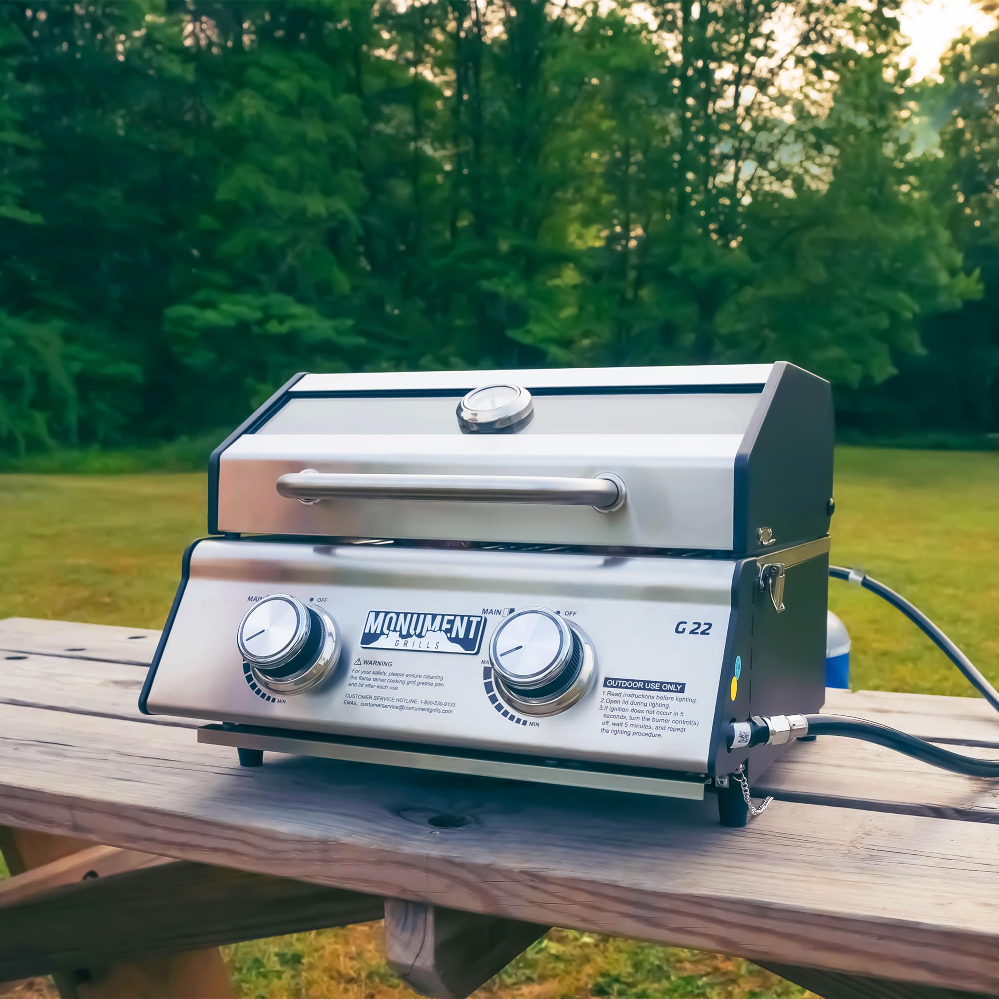 Monument Grills in use at a campsite showing easy transport and outdoor cooking convenience