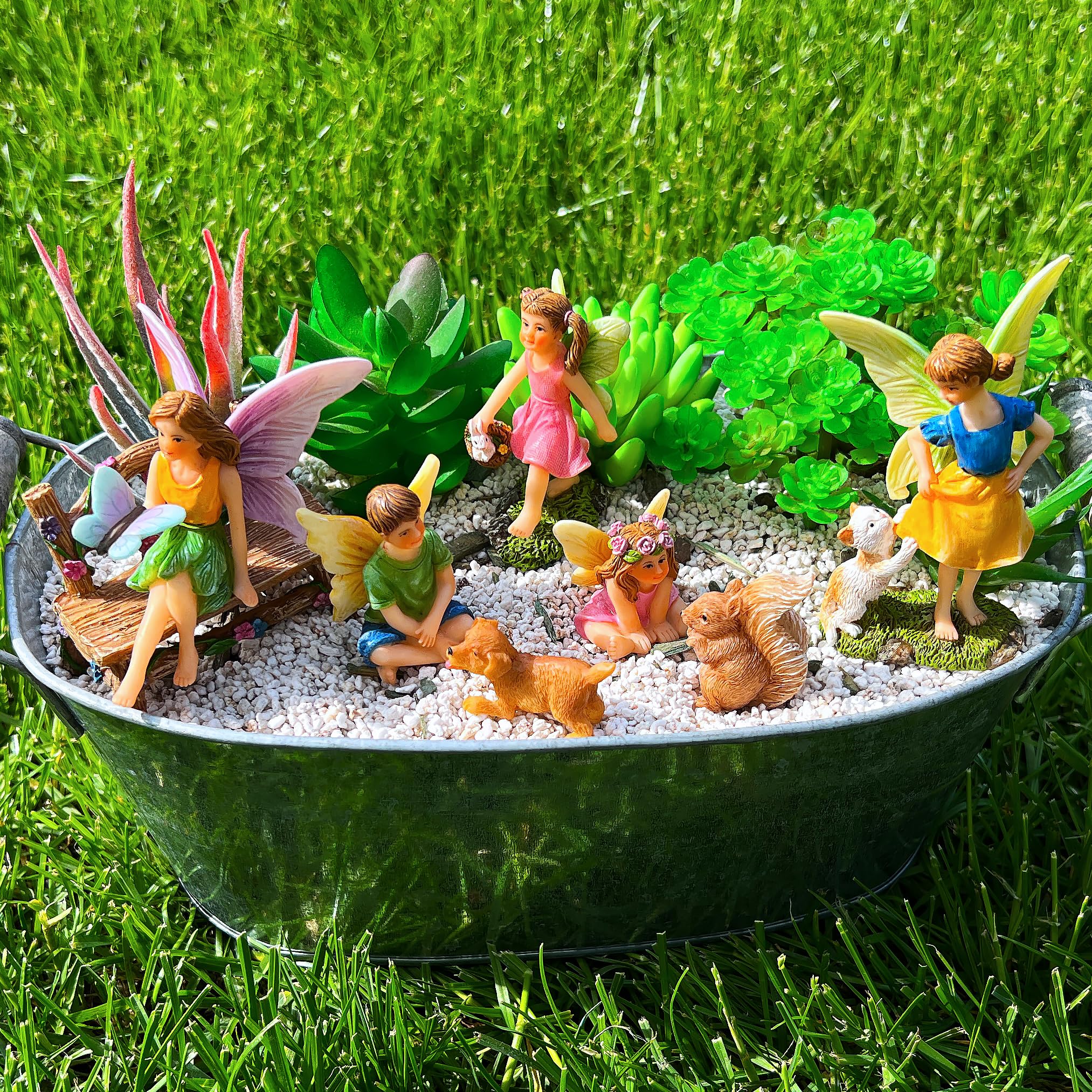 Hand holding a Mood Lab figurine to show scale and portability for small garden use