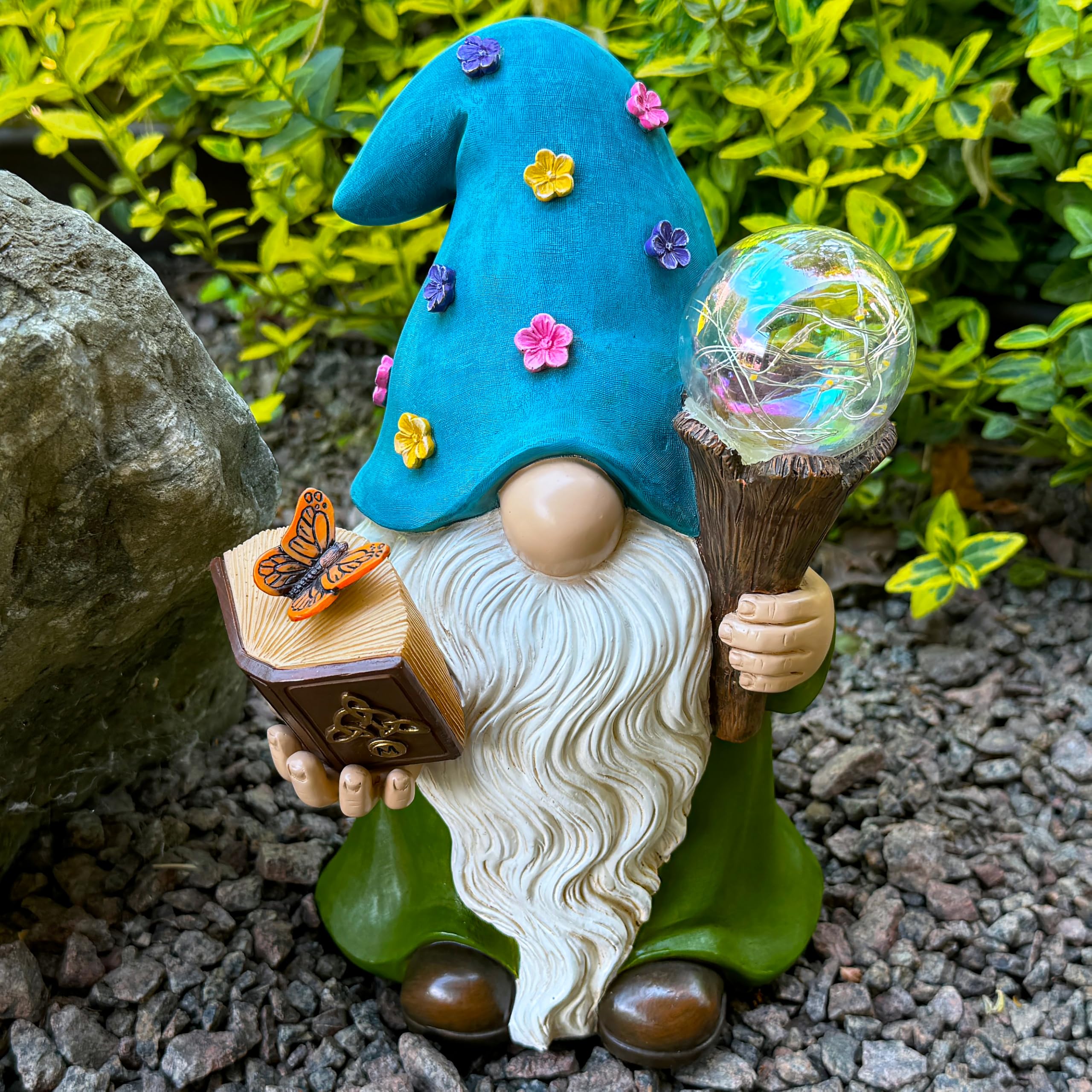 Mood Lab gnome placed in flower bed demonstrating decorative curb appeal outdoors