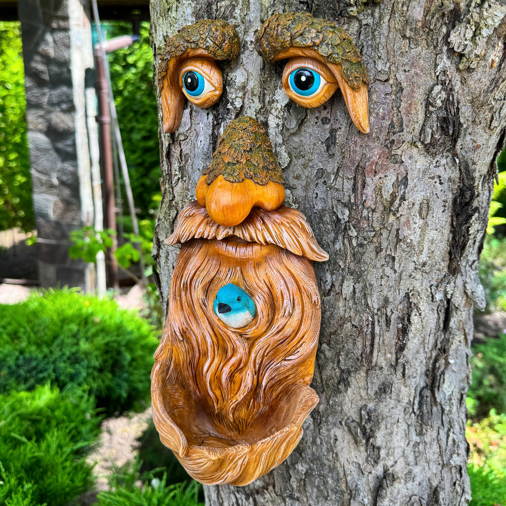 Mood Lab tree face in garden setting enhancing landscape with personality