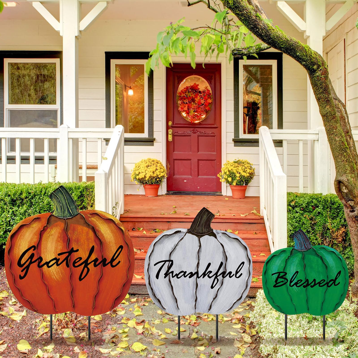 MorningRo front view of three pumpkin stakes adding curb appeal