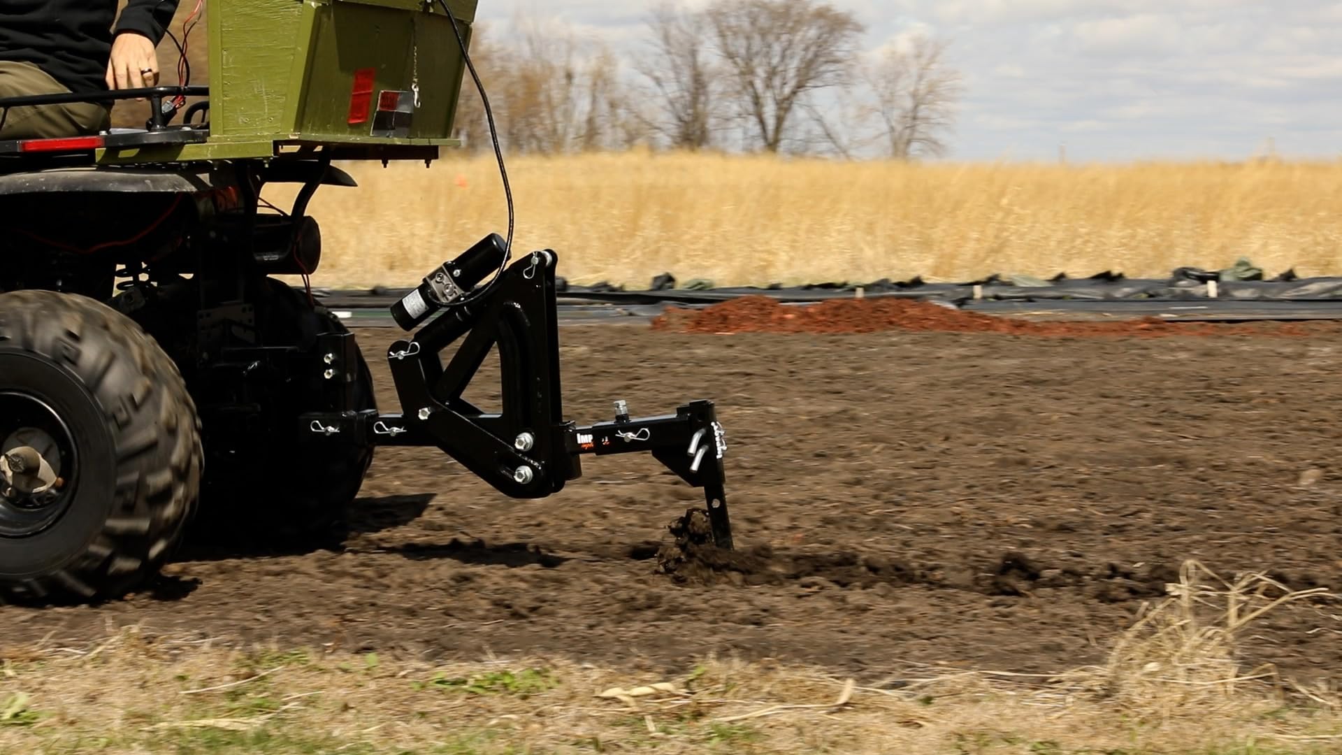MotoAlliance Middle Buster cutting through roots in a field, fast soil penetration benefit