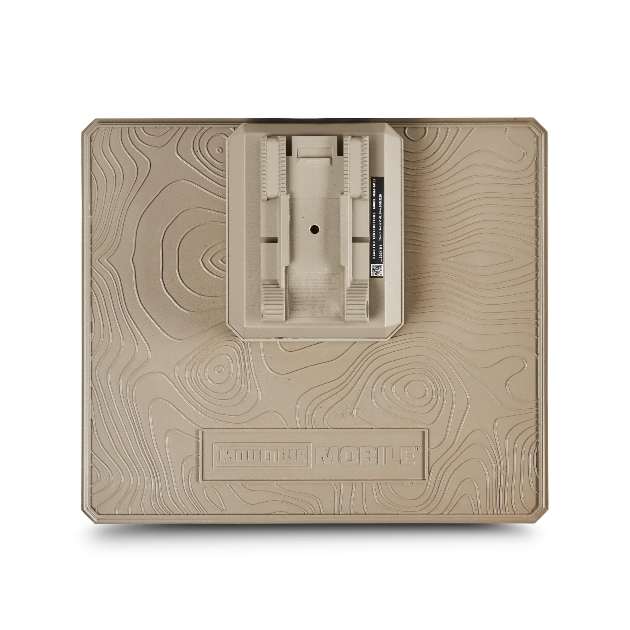 Moultrie panel held in hand showing compact size for easy mounting