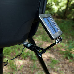 Moultrie solar panel mounted on feeder in field, provides continuous trickle charging