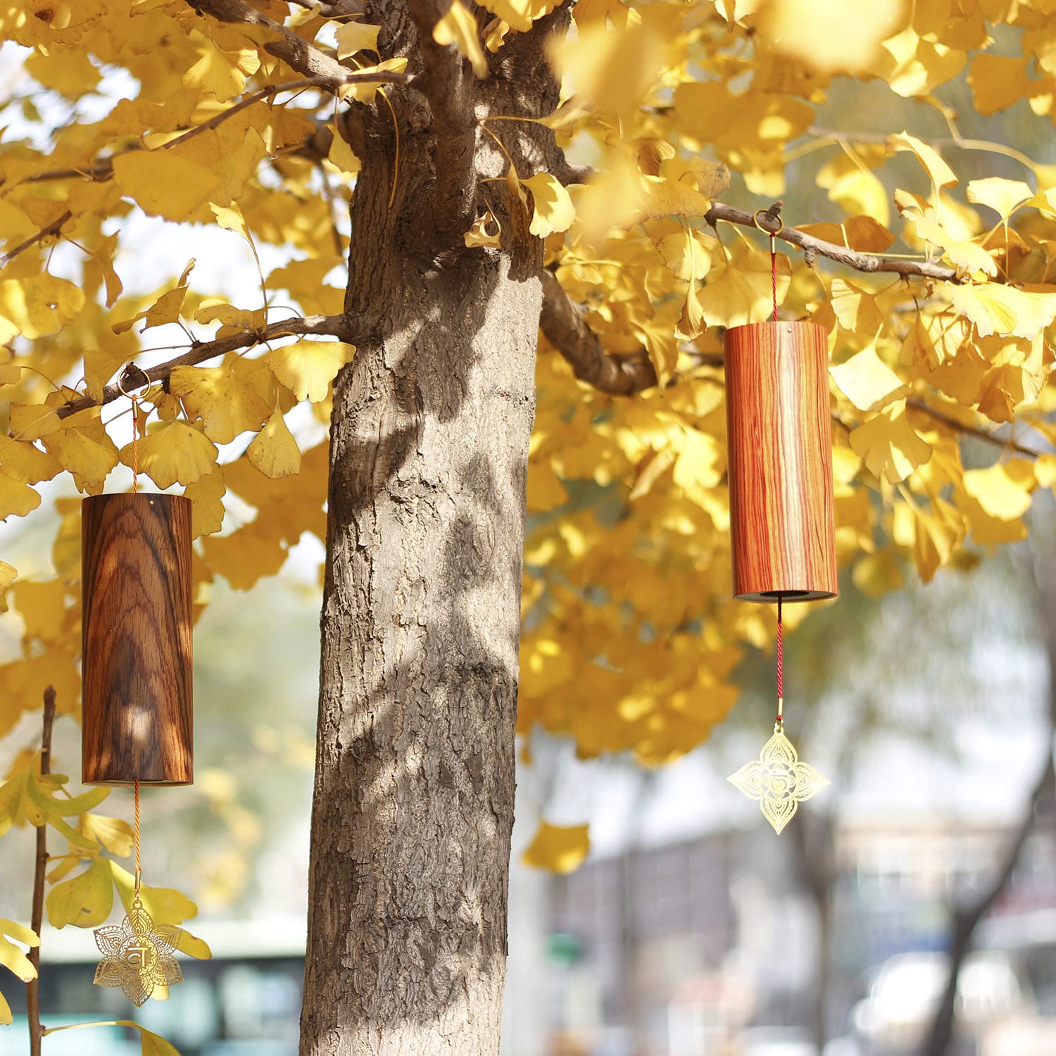 Mowind windchime shown with hand for scale demonstrating its lightweight portability