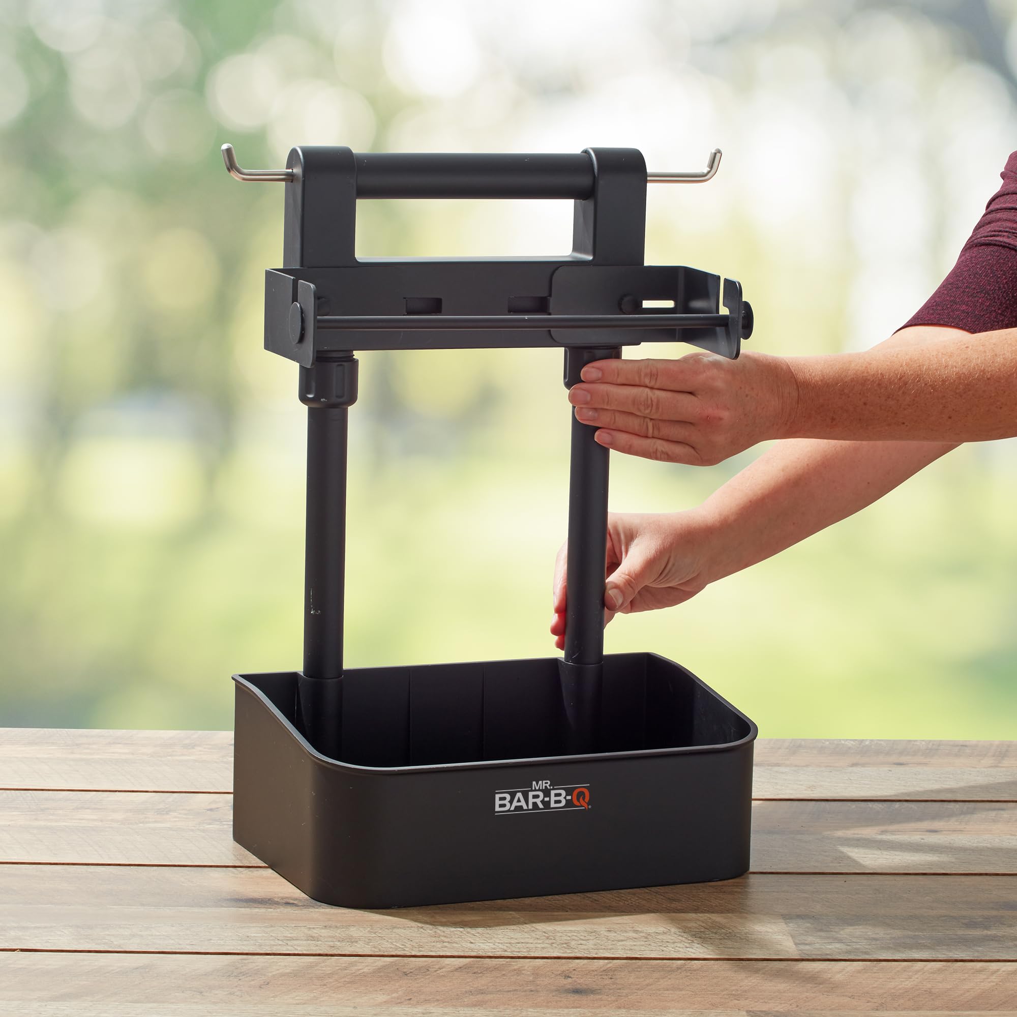 Mr. Bar-B-Q compartments filled with sauces and tools for quick access