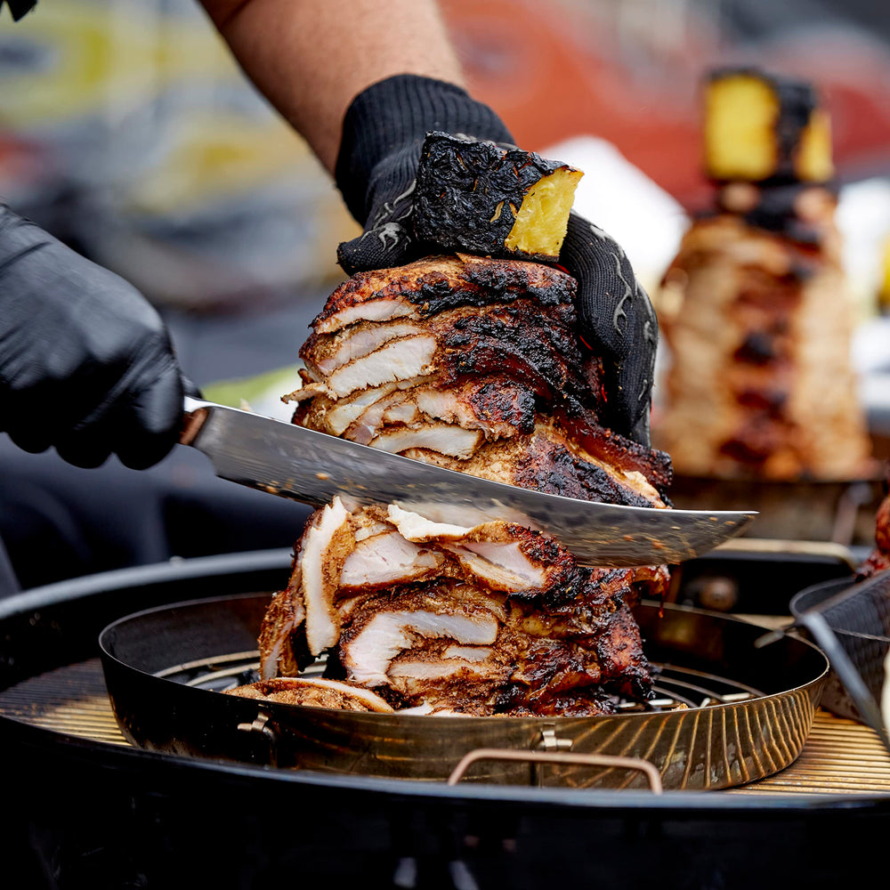 Mr. Bar-B-Q griller beside a hand showing scale and portability benefit