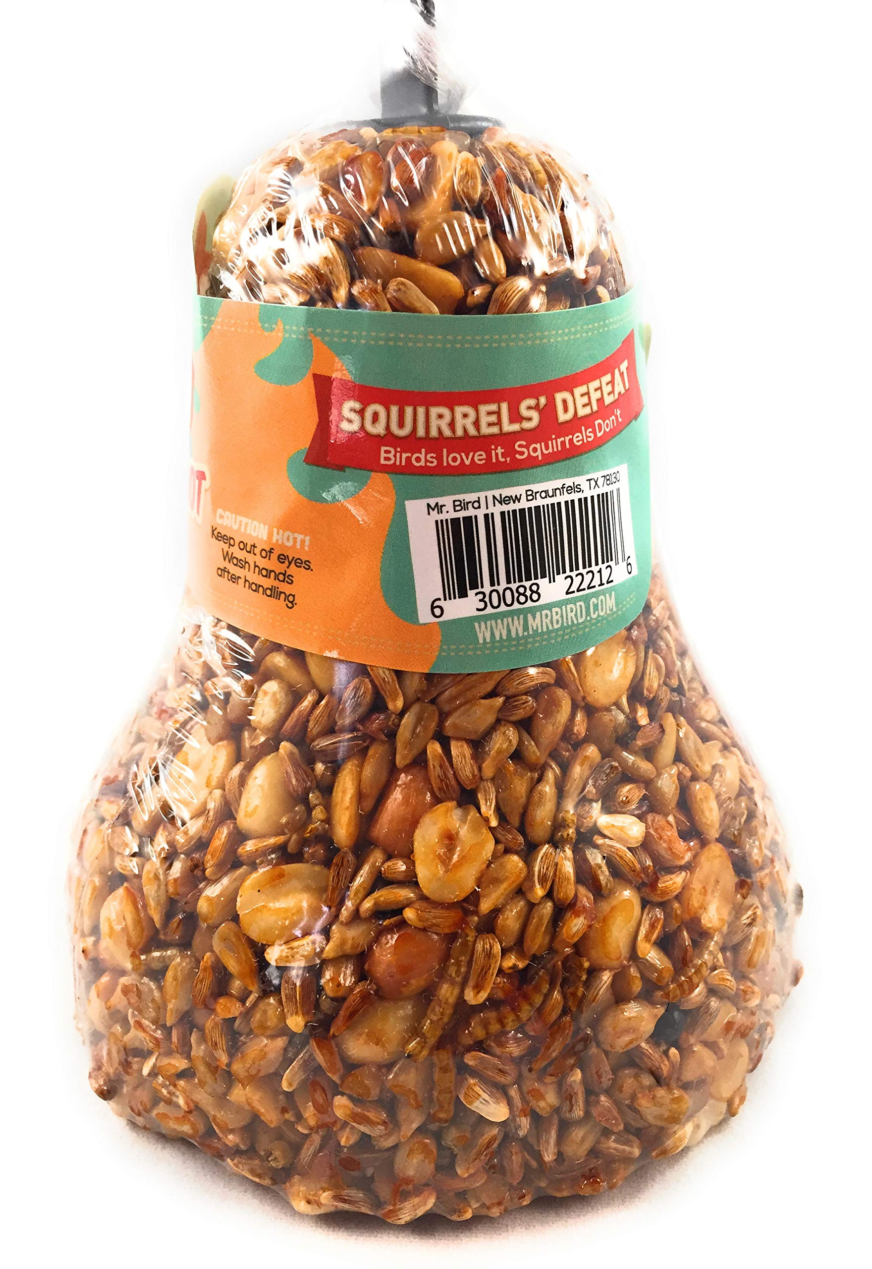 Mr. Bird seed bell held in hand to show scale and easy placement benefit