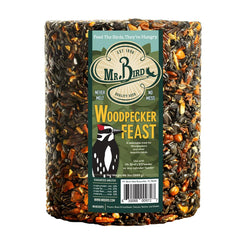 Mr. Bird cylinder in feeder attracting woodpeckers and reducing feeder mess