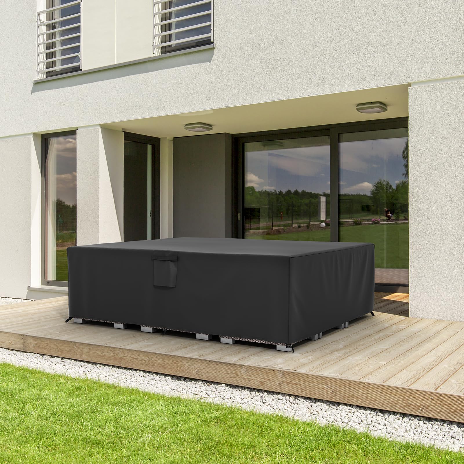 MR. COVER on a patio covering sofa illustrating weatherproof outdoor use
