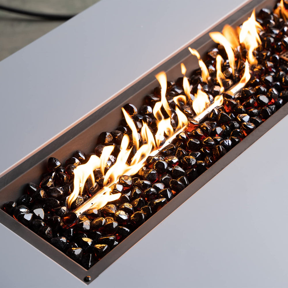 Mr. Fireglass in a fire pit creating warm amber reflections and ambiance