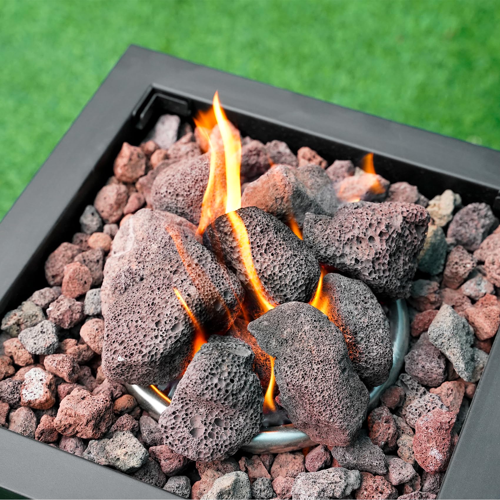 Mr. Fireglass granules installed in a gas fire pit showing steadier flames and decorative finish