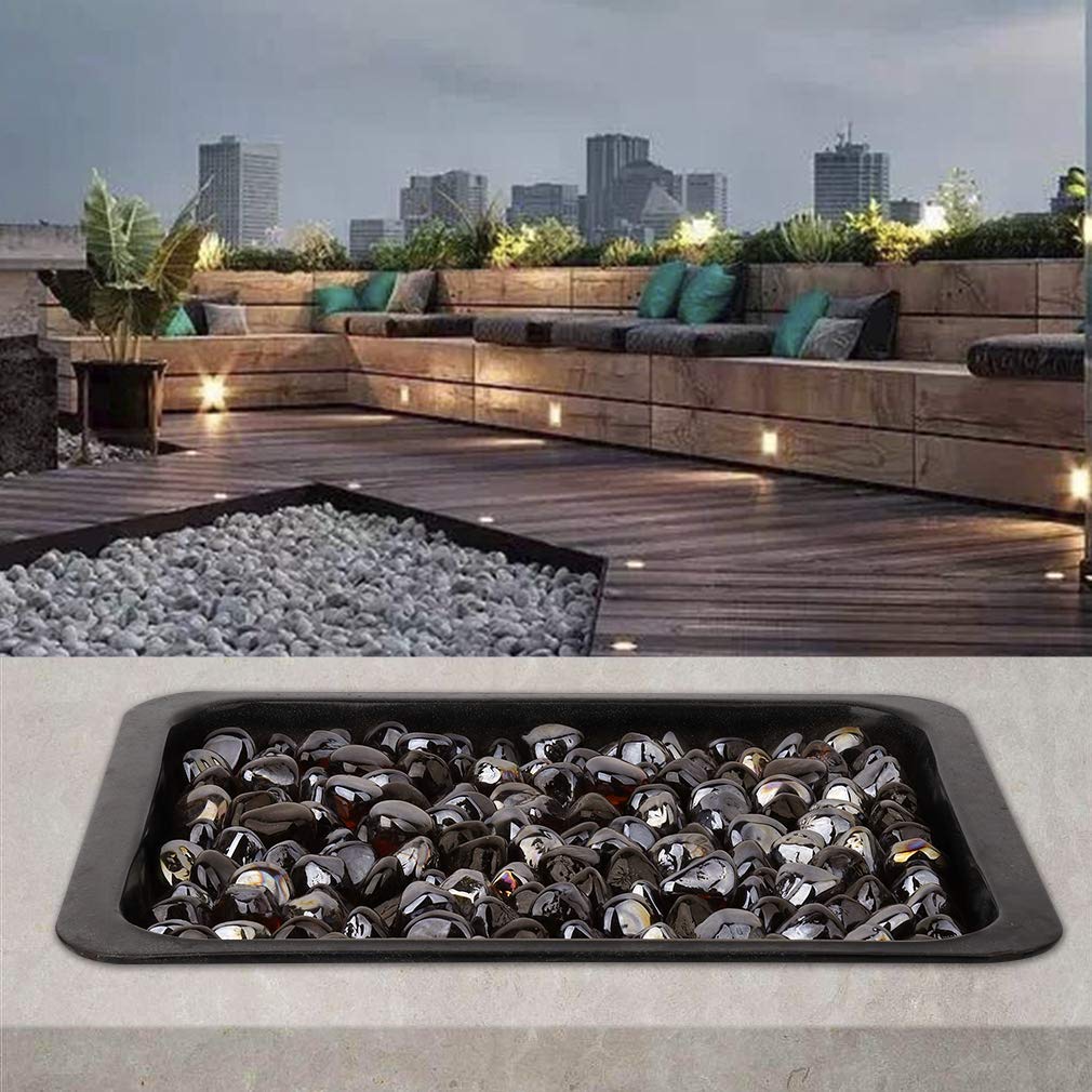 Mr. Fireglass in a water feature producing shimmering amber highlights