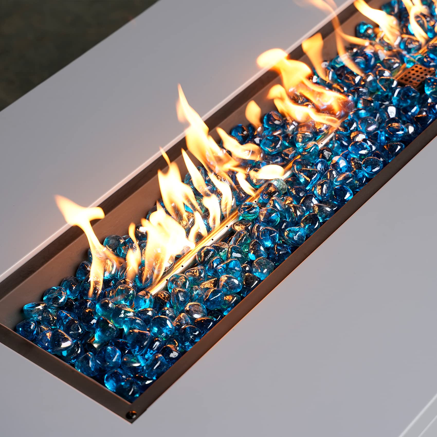 Mr. Fireglass in water feature reflecting sunlight and adding color contrast