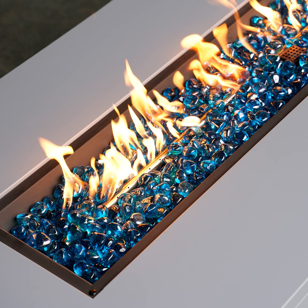 Mr. Fireglass in water feature reflecting sunlight and adding color contrast