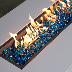 Mr. Fireglass in water feature reflecting sunlight and adding color contrast